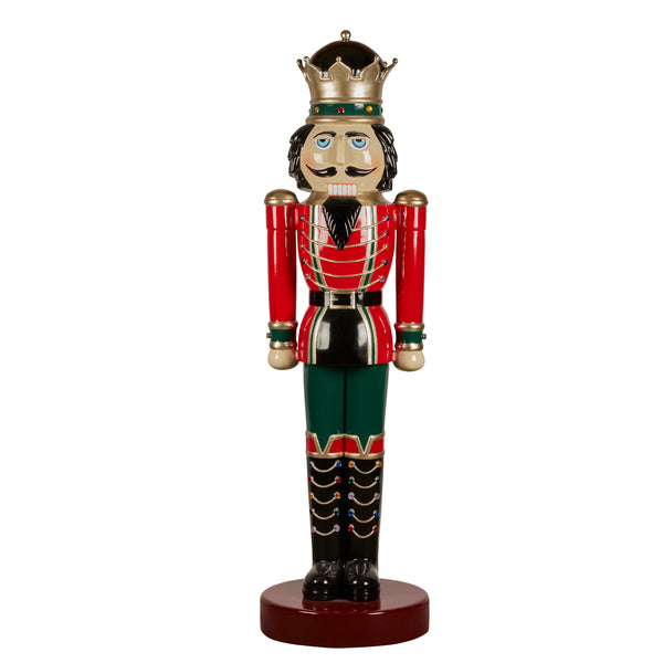 Decorative nutcracker figurine with a red and gold king's outfit on a white background